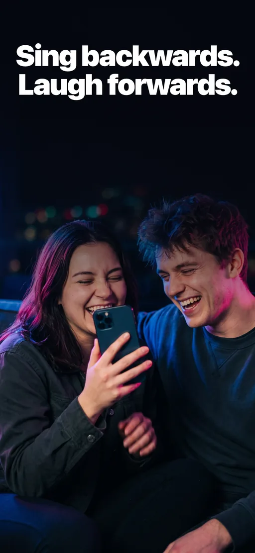 Two friends laughing on a sofa, one holding a phone like a microphone, under the headline Sing backwards. Laugh forwards.
